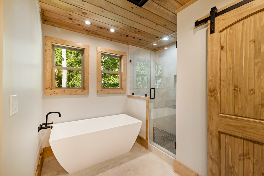 78 Pocola Court Ellijay, GA 30540 - Photo 34 of 47 a bathroom with a bathtub and shower