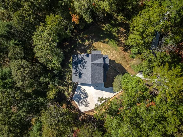 a backyard of a house with lots of green space