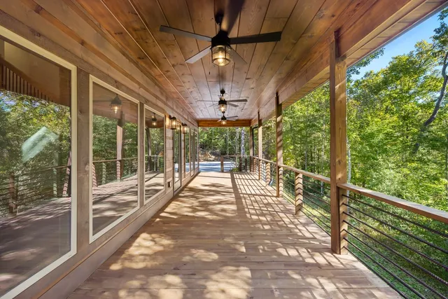 a view of a porch with wooden floor and outdoor space