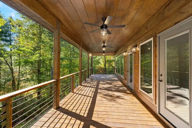 a view of balcony with wooden floor