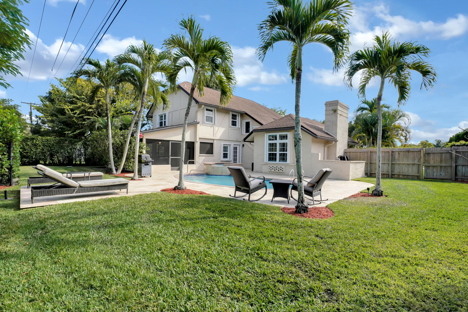 979 Southwest 18th Street Boca Raton, FL 33486 - Photo 30 of 30 a view of a house with backyard porch and sitting area