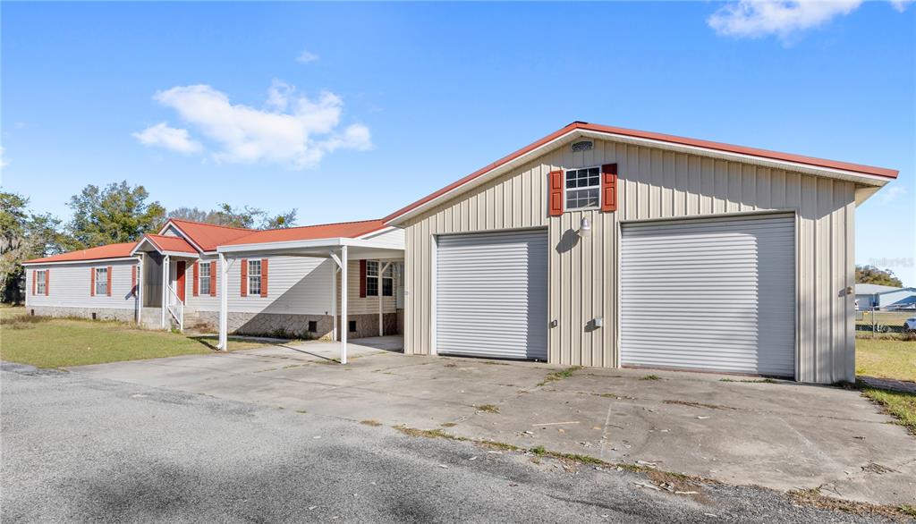 32443 Memory Lane Leesburg, FL 34788 - Photo 1 of 51 a view of house with outdoor space and parking