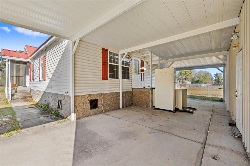 32443 Memory Lane Leesburg, FL 34788 - Photo 12 of 51 a view of a house with porch and garden