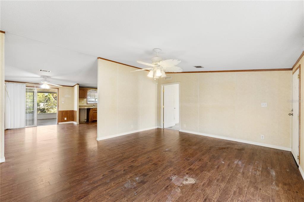 32443 Memory Lane Leesburg, FL 34788 - Photo 13 of 51 a view of a livingroom with wooden floor