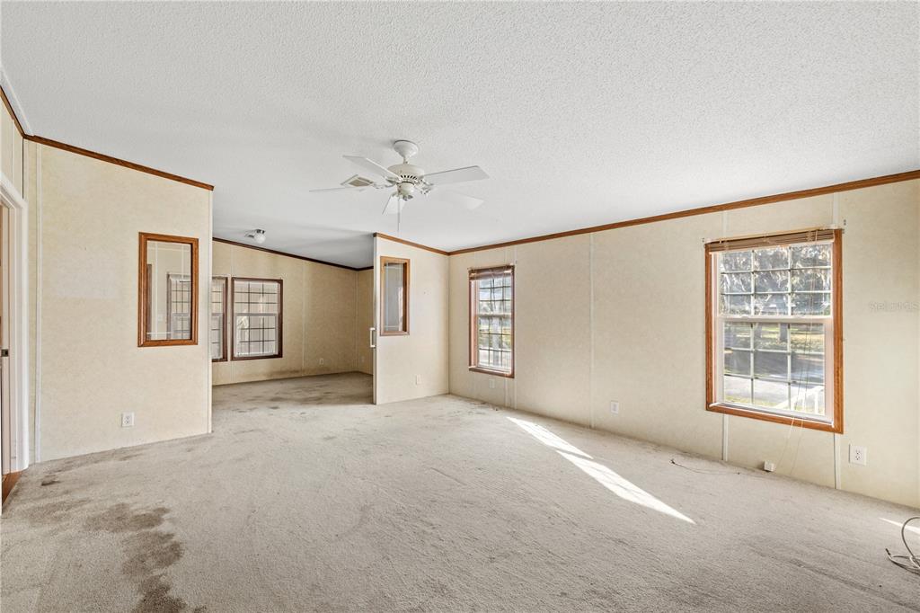 32443 Memory Lane Leesburg, FL 34788 - Photo 16 of 51 a view of an empty room with a window