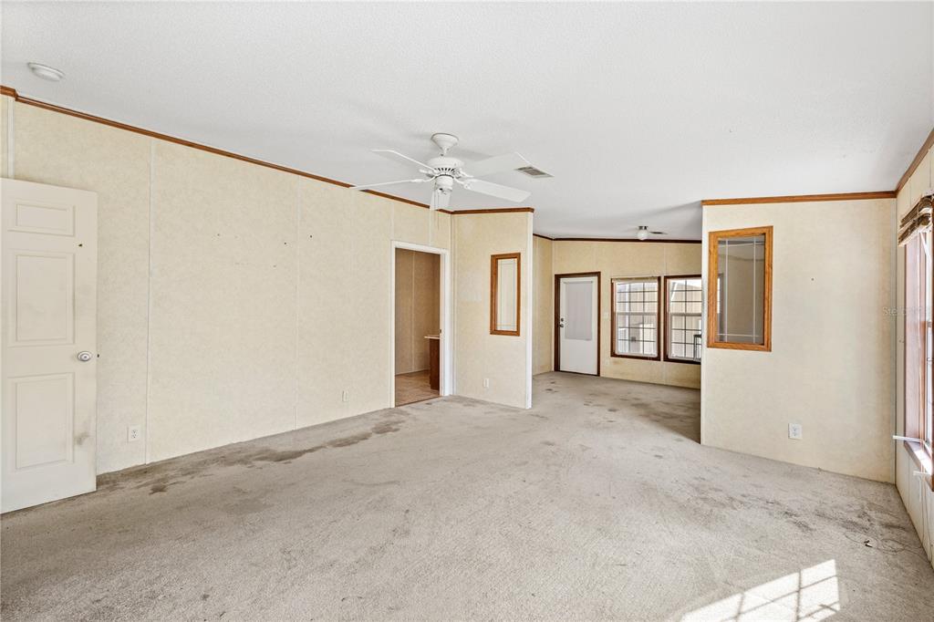 32443 Memory Lane Leesburg, FL 34788 - Photo 17 of 51 an empty room with windows and closet