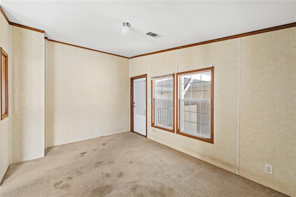 32443 Memory Lane Leesburg, FL 34788 - Photo 19 of 51 a view of an empty room with a window