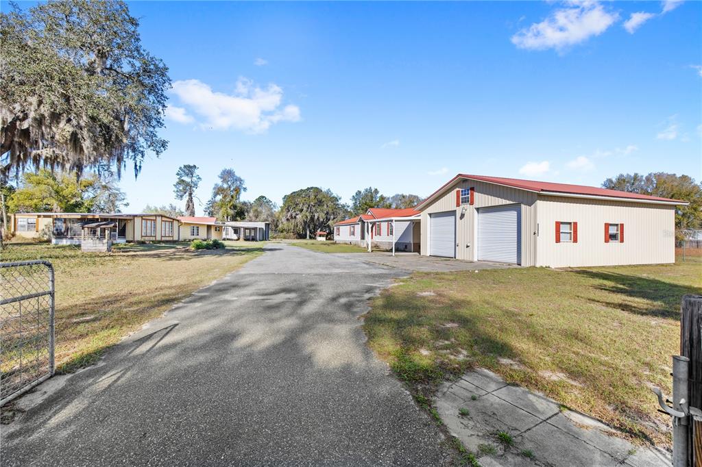 32443 Memory Lane Leesburg, FL 34788 - Photo 2 of 51 a view of a house with a yard