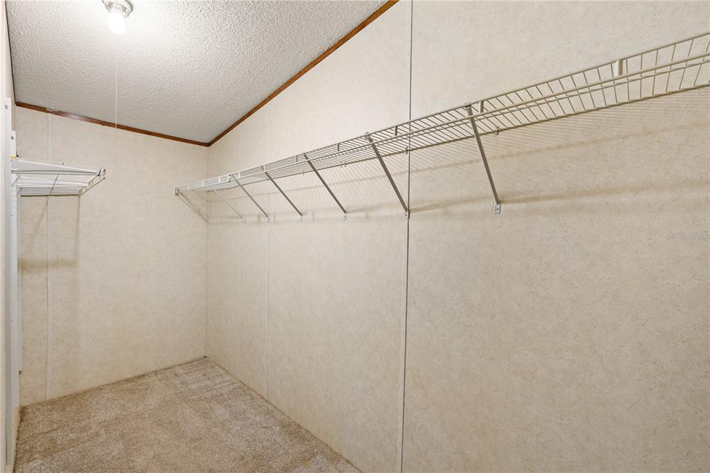 32443 Memory Lane Leesburg, FL 34788 - Photo 23 of 51 a view of a room with racks on the wall
