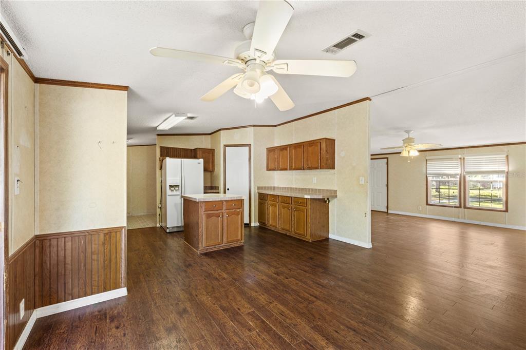 32443 Memory Lane Leesburg, FL 34788 - Photo 26 of 51 a view of an empty room with window and wooden floor
