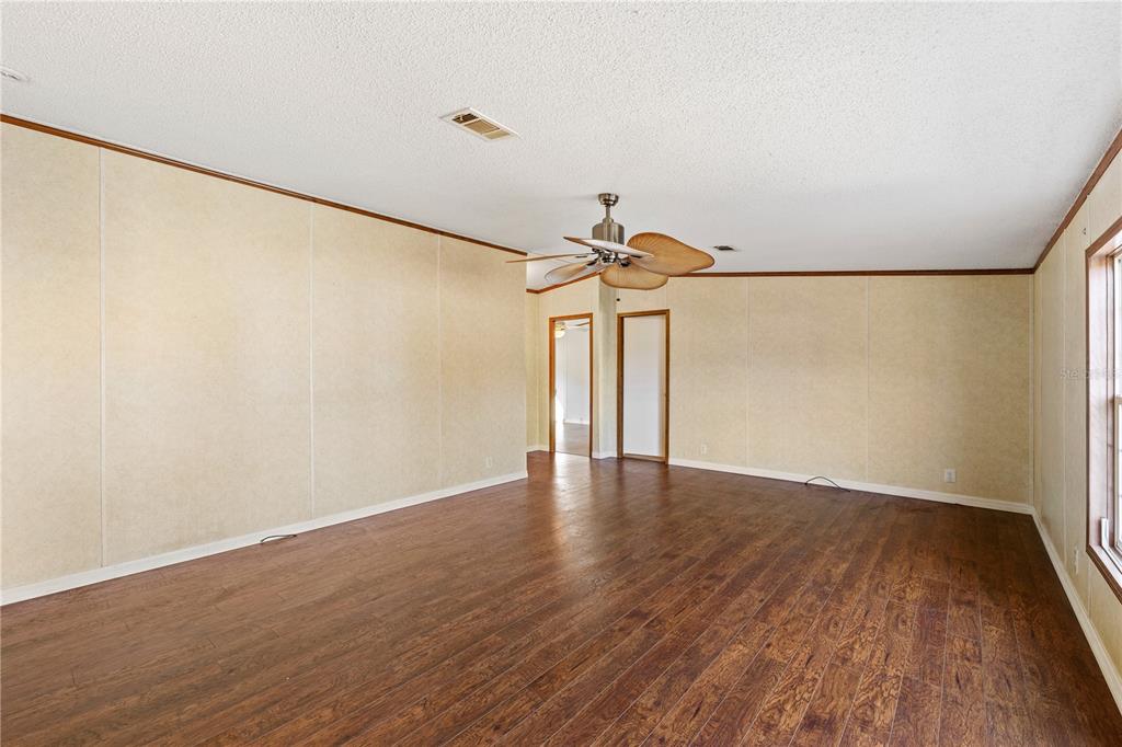 32443 Memory Lane Leesburg, FL 34788 - Photo 32 of 51 a view of a room with wooden floor