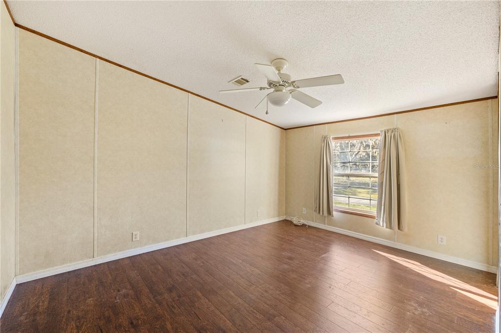 32443 Memory Lane Leesburg, FL 34788 - Photo 39 of 51 a view of an empty room with a window