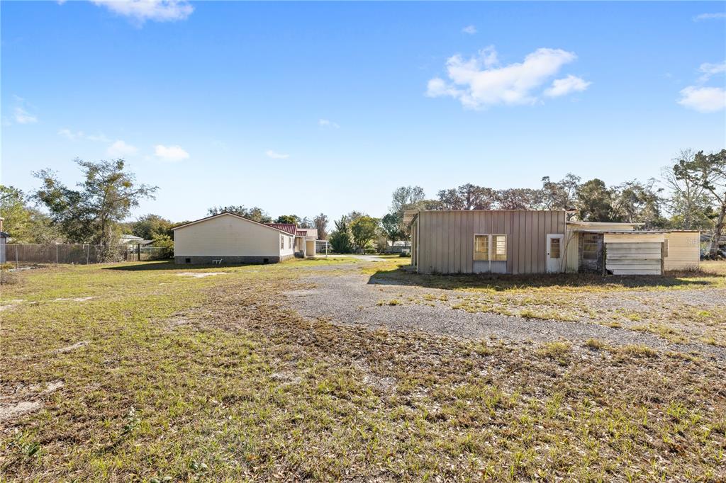 32443 Memory Lane Leesburg, FL 34788 - Photo 44 of 51 a view of a dry yard with wooden fence