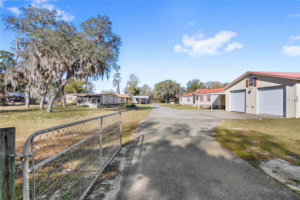 32443 Memory Lane Leesburg, FL 34788 - Photo 47 of 51 a view of a house with a yard