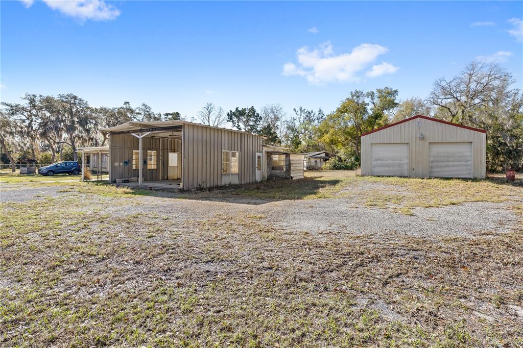 32443 Memory Lane Leesburg, FL 34788 - Photo 5 of 51 a view of a house with a yard