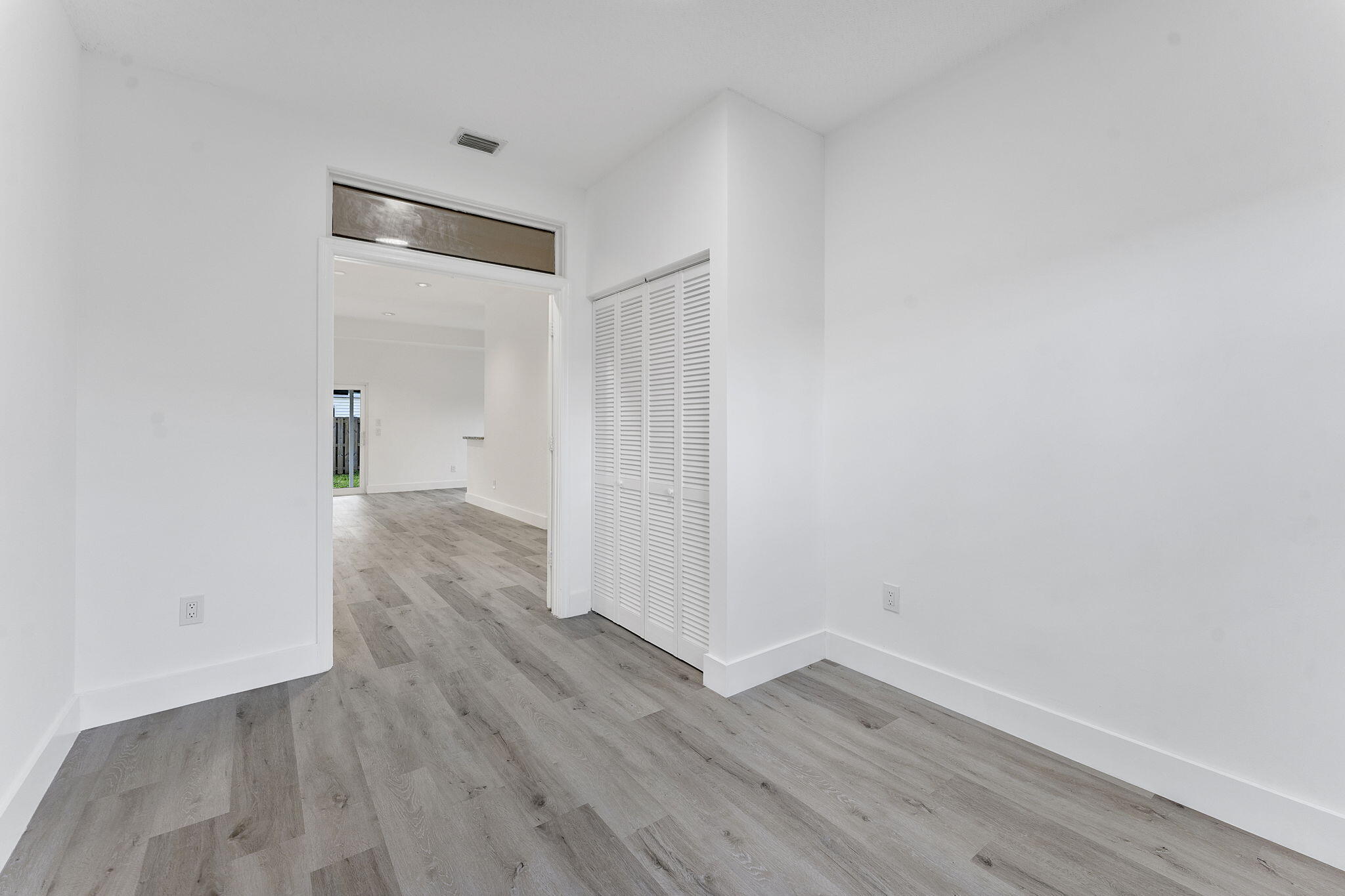 23157 Old Inlet Bridge Drive Boca Raton, FL 33433 - Photo 15 of 39 a view of a room with wooden floor