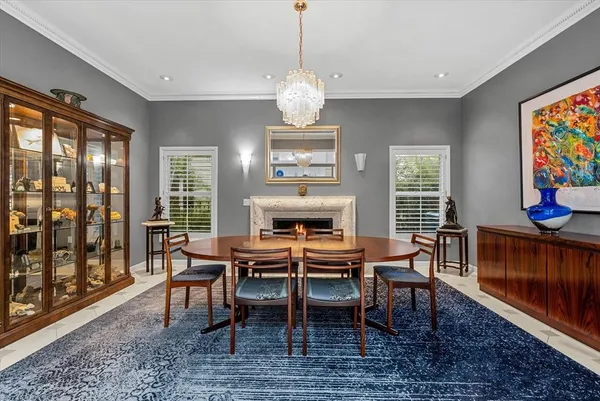 a living room with furniture and a dresser