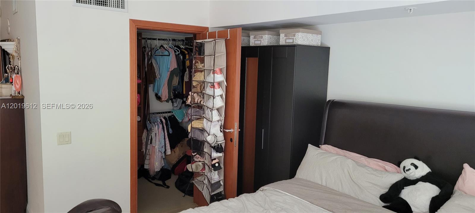 9499 Collins Avenue, Unit 705 Surfside, FL 33154 - Photo 13 of 29 a view of walk in closet