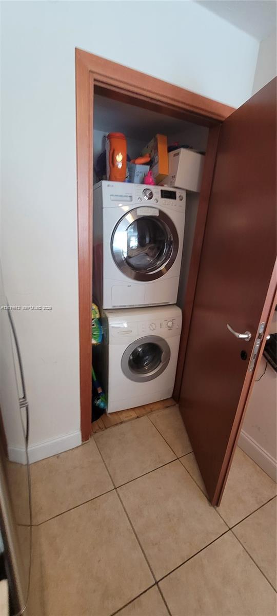 9499 Collins Avenue, Unit 705 Surfside, FL 33154 - Photo 14 of 29 a close view of a utility room with dryer and washer