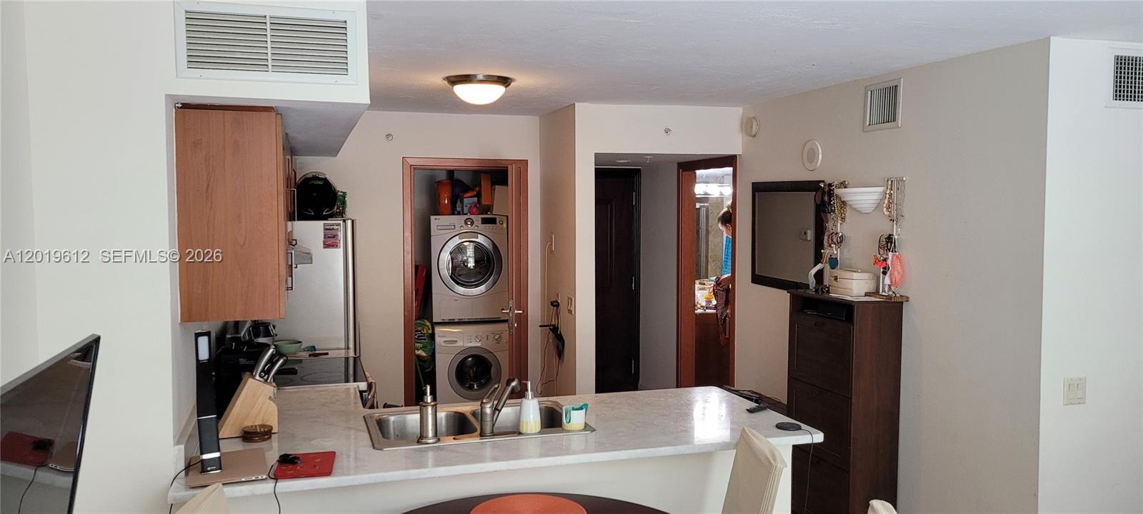 9499 Collins Avenue, Unit 705 Surfside, FL 33154 - Photo 7 of 29 a bathroom with a sink vanity and a mirror
