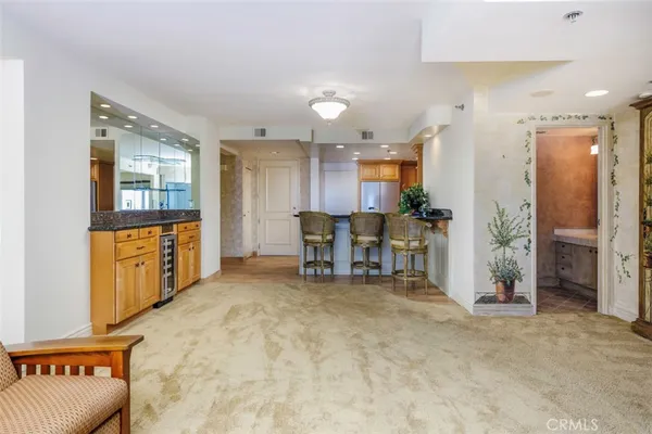 a view of a kitchen with furniture and a large window
