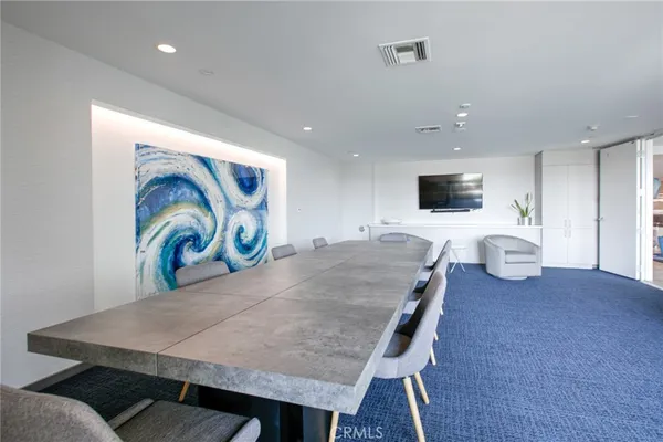 a living room with furniture and flat screen tv