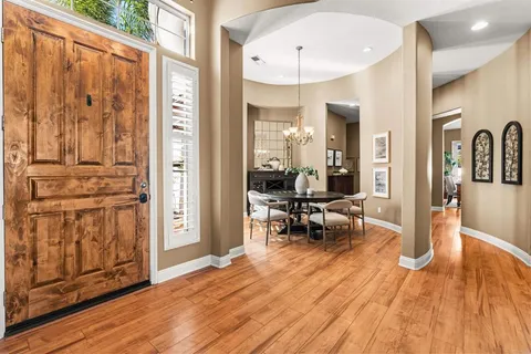 a living room with furniture a rug and a fireplace