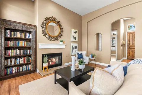 a large kitchen with stainless steel appliances kitchen island granite countertop a sink a counter top space and cabinets