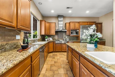a large living room with a large tub and glass windows