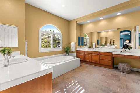 a view of a patio with table and chairs and wooden floor