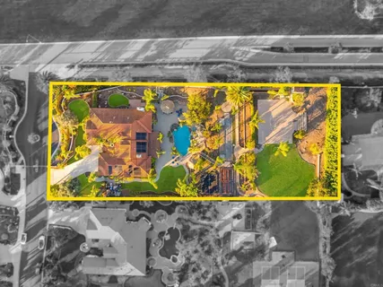 a view of a swimming pool with a patio