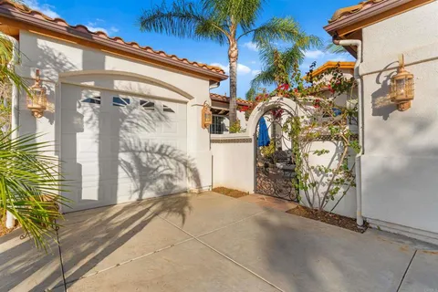 a view of a patio with dining table and chairs