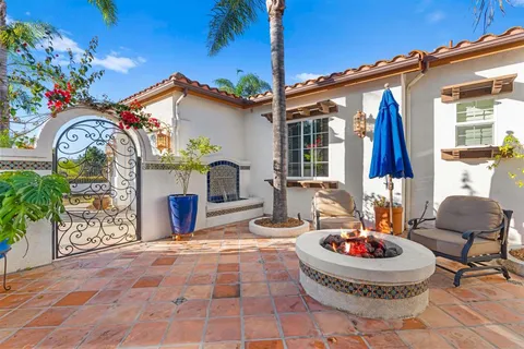 a view of a hallway with wooden floor and dining room