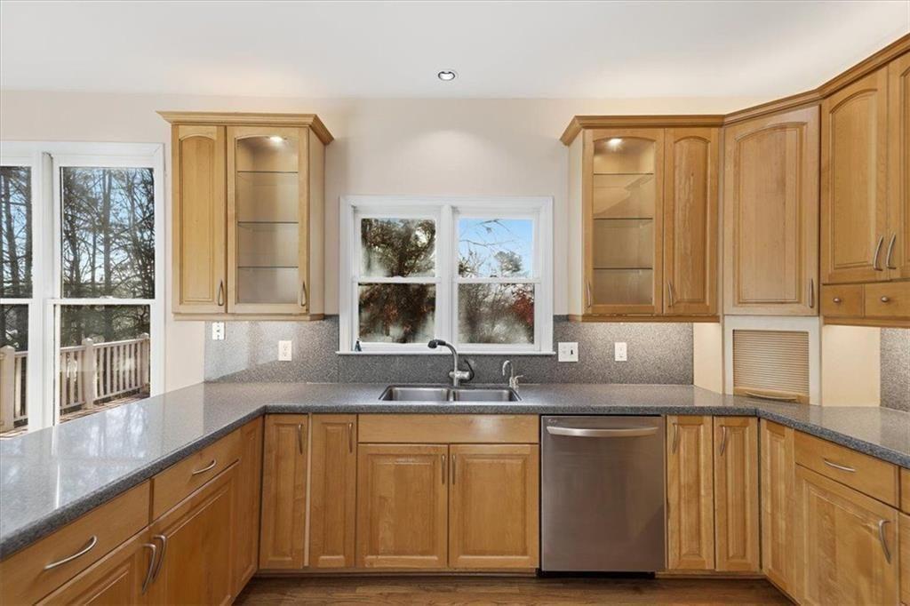 834 Valley Drive Canton, GA 30114 - Photo 11 of 49 a kitchen with granite countertop a sink and a window