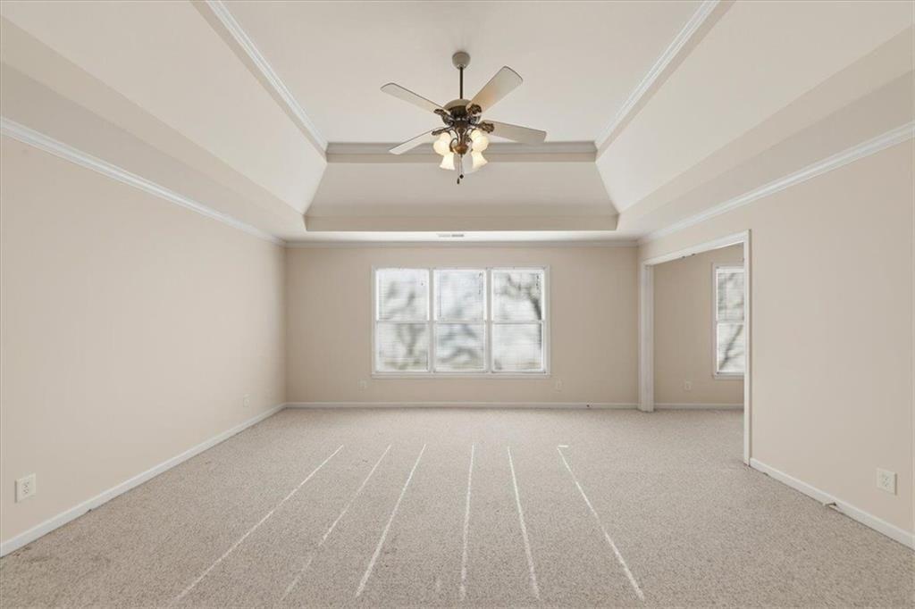 834 Valley Drive Canton, GA 30114 - Photo 18 of 49 an empty room with windows and ceiling fan