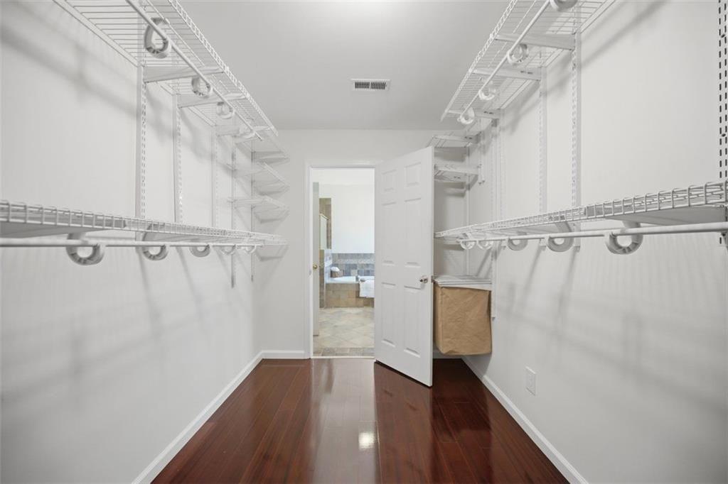 834 Valley Drive Canton, GA 30114 - Photo 23 of 49 a view of a hallway with wooden floor and staircase