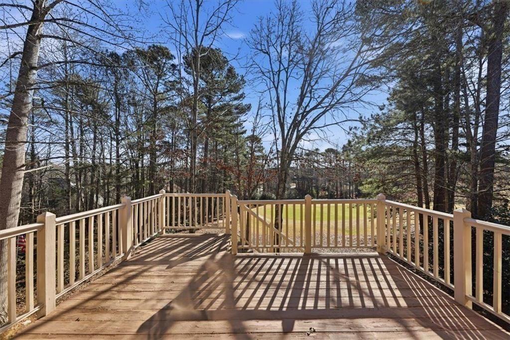 834 Valley Drive Canton, GA 30114 - Photo 37 of 49 a view of backyard with deck and wooden floor