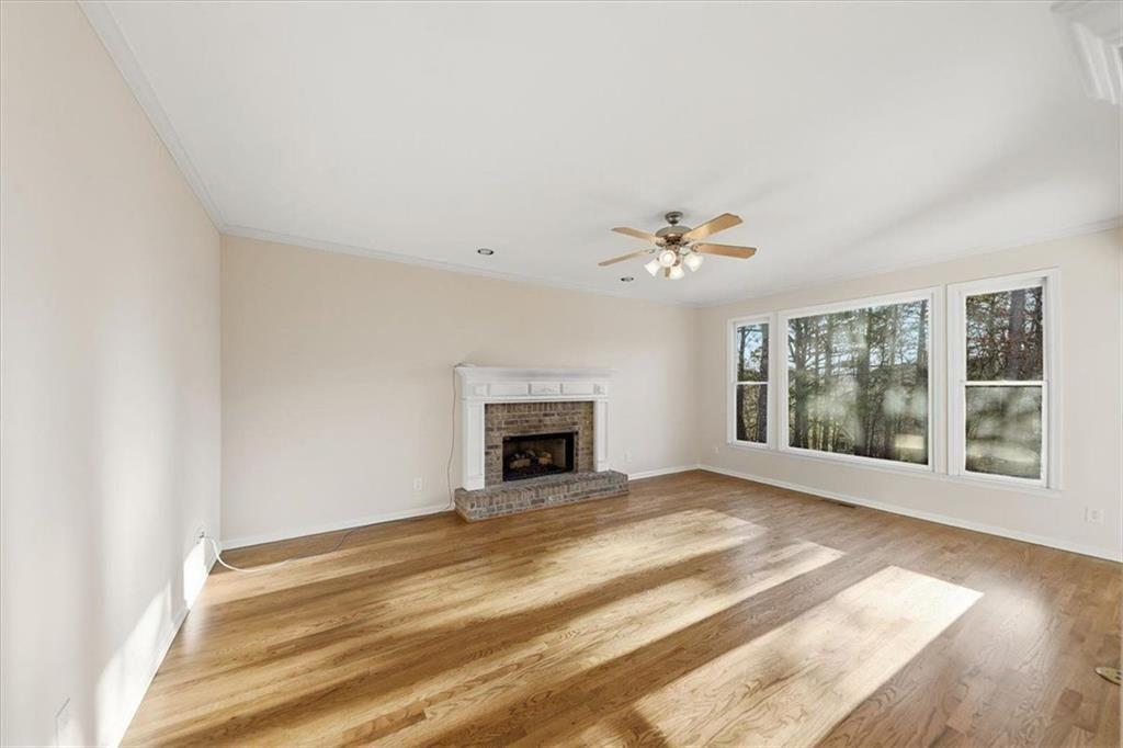 834 Valley Drive Canton, GA 30114 - Photo 9 of 49 a view of an empty room with window and fireplace