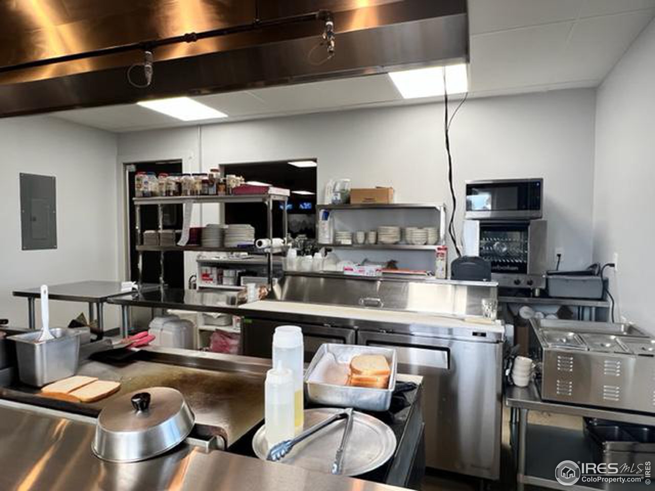 688 Main Street Walden, CO 80480 - Photo 17 of 22 a room with stainless steel appliances kitchen island granite countertop a sink and cabinets