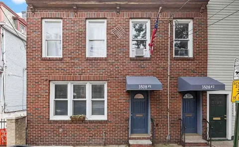 a front view of a building with windows