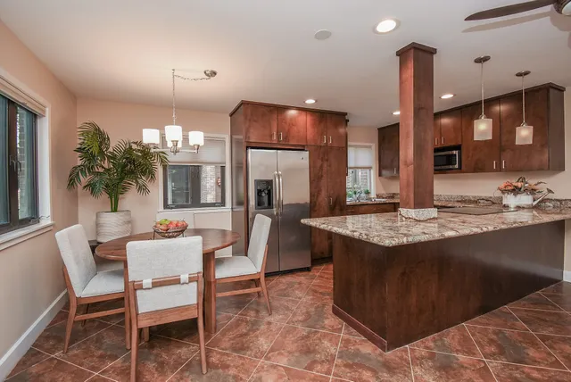 a kitchen with a table and chairs in it