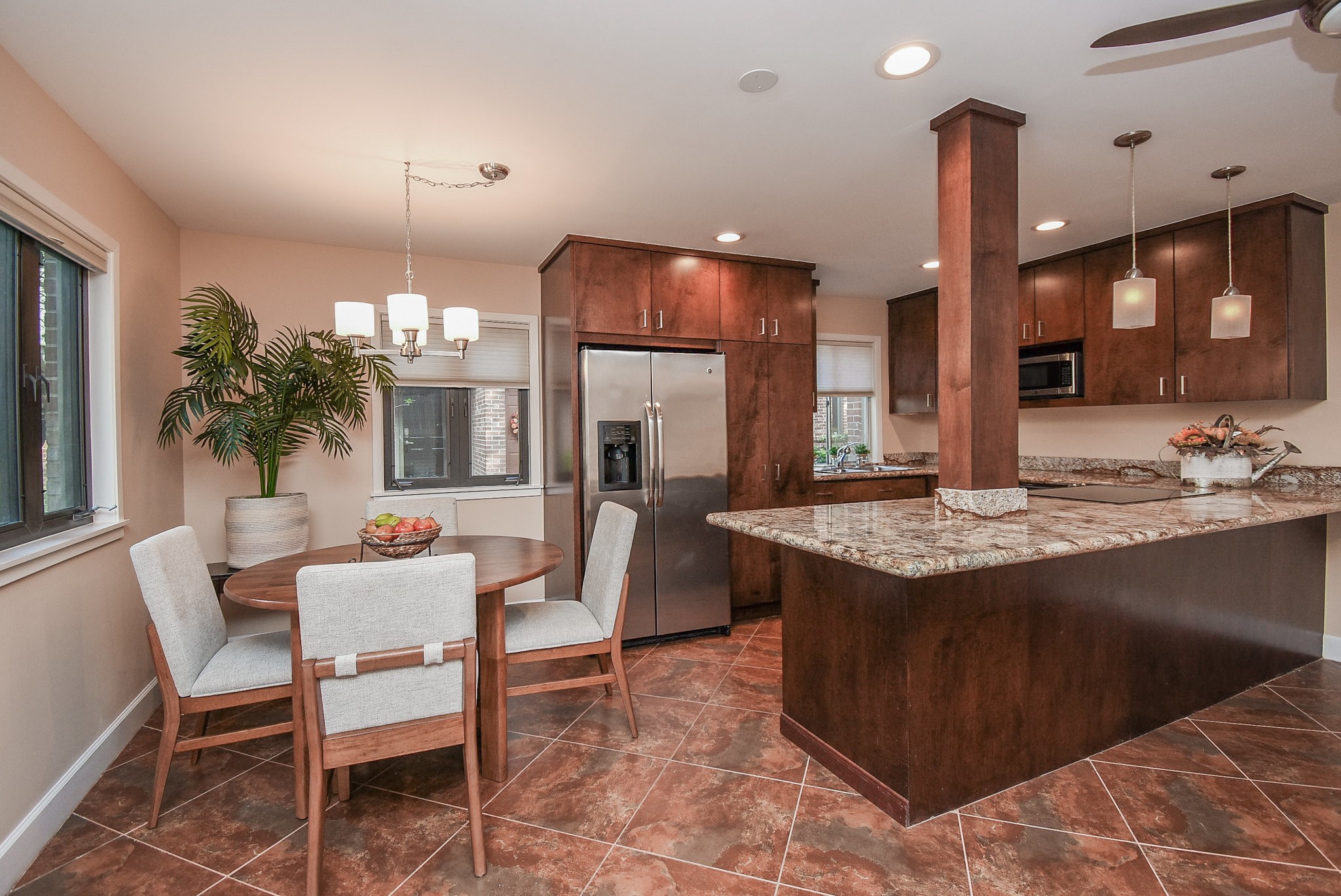 a kitchen with a table and chairs in it
