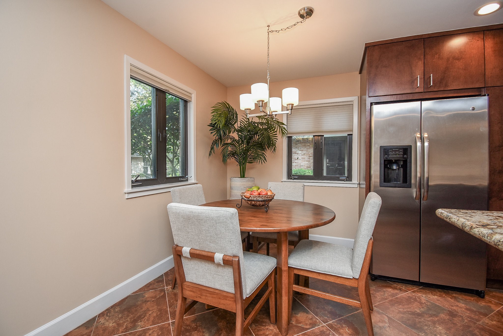 6401 Bayou Glen Road Houston, TX 77057 - Photo 12 of 22 a dining room with furniture a chandelier and wooden floor