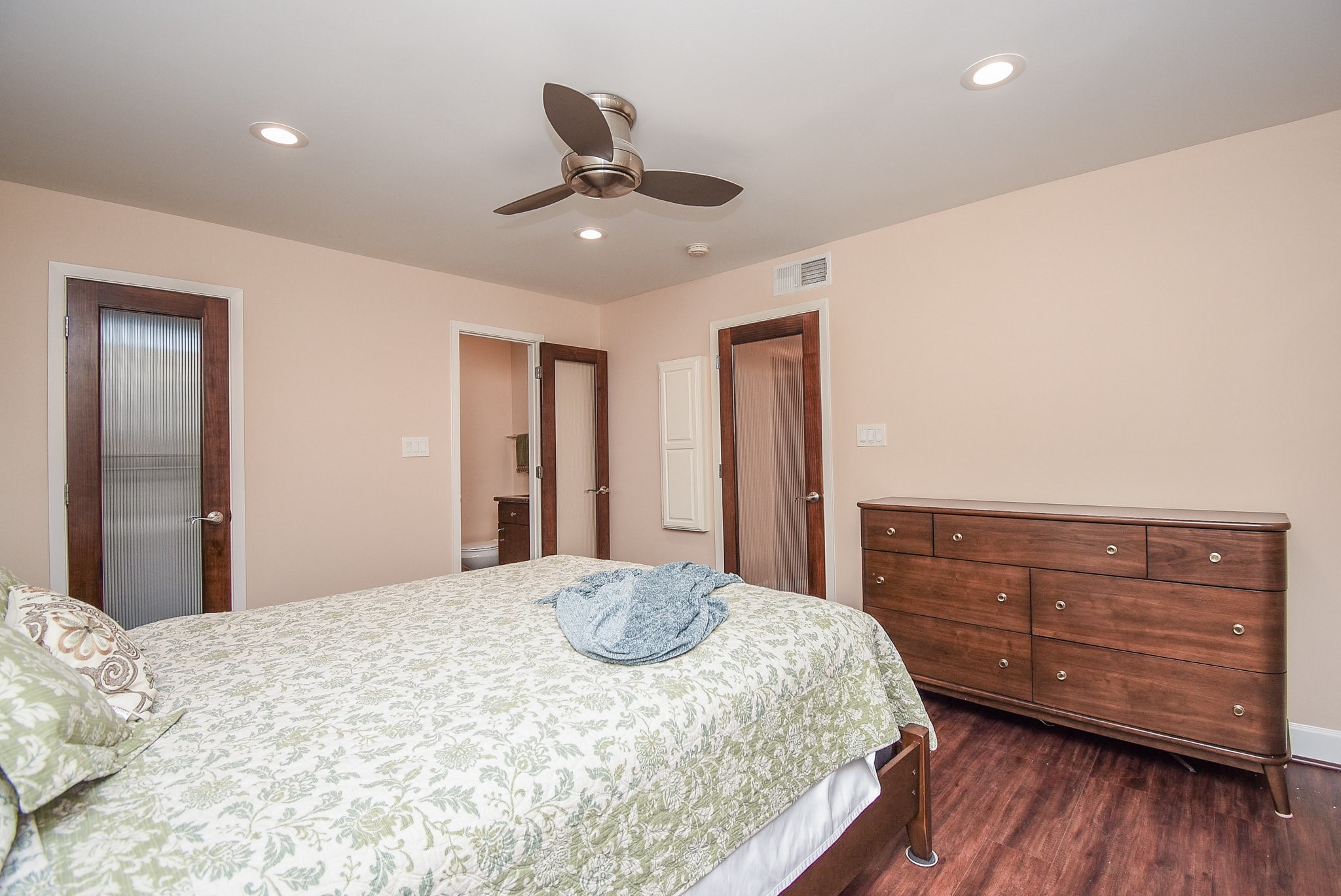 6401 Bayou Glen Road Houston, TX 77057 - Photo 16 of 22 a bedroom with a bed and a dresser