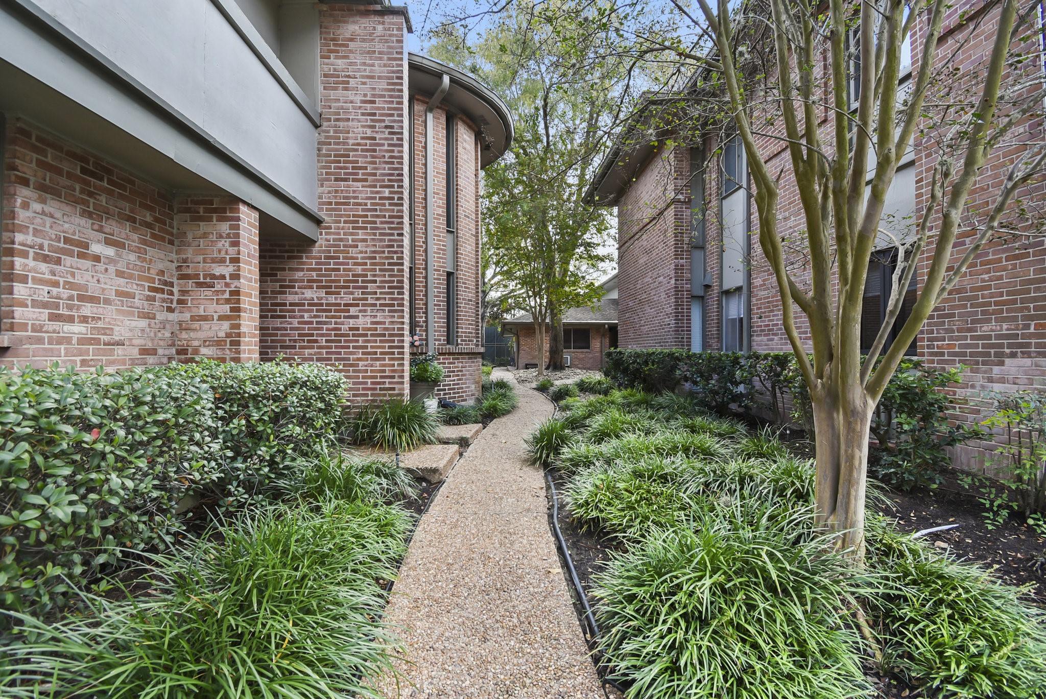 6401 Bayou Glen Road Houston, TX 77057 - Photo 3 of 22 a view of a pathway with a house