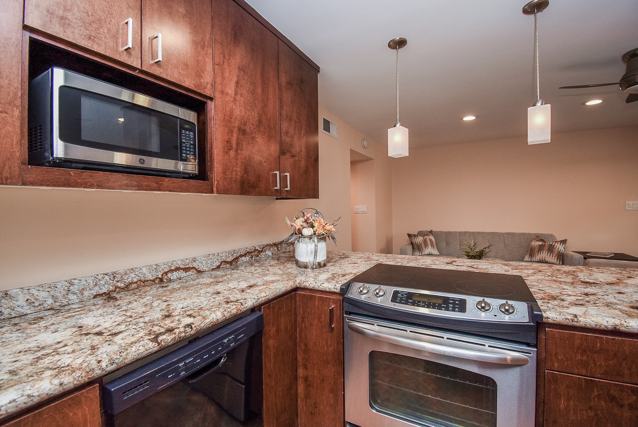 6401 Bayou Glen Road Houston, TX 77057 - Photo 10 of 22 a kitchen with a stove and a microwave