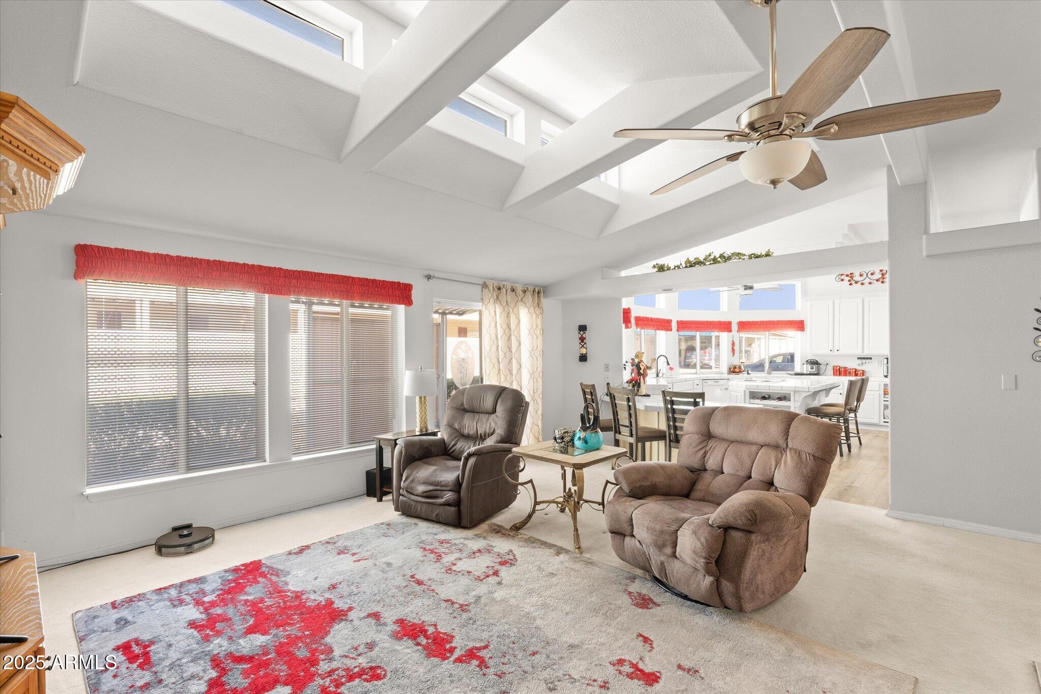 3700 South Tomahawk Road, Unit 26 & 27 Apache Junction, AZ 85119 - Photo 11 of 62 a living room with furniture and a floor to ceiling window