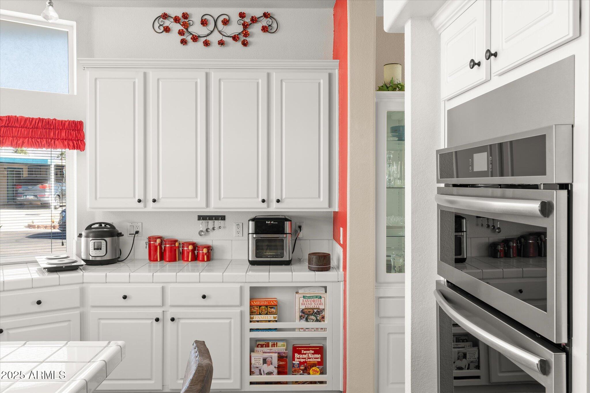3700 South Tomahawk Road, Unit 26 & 27 Apache Junction, AZ 85119 - Photo 12 of 62 a kitchen with stainless steel appliances granite countertop a refrigerator and a stove top oven
