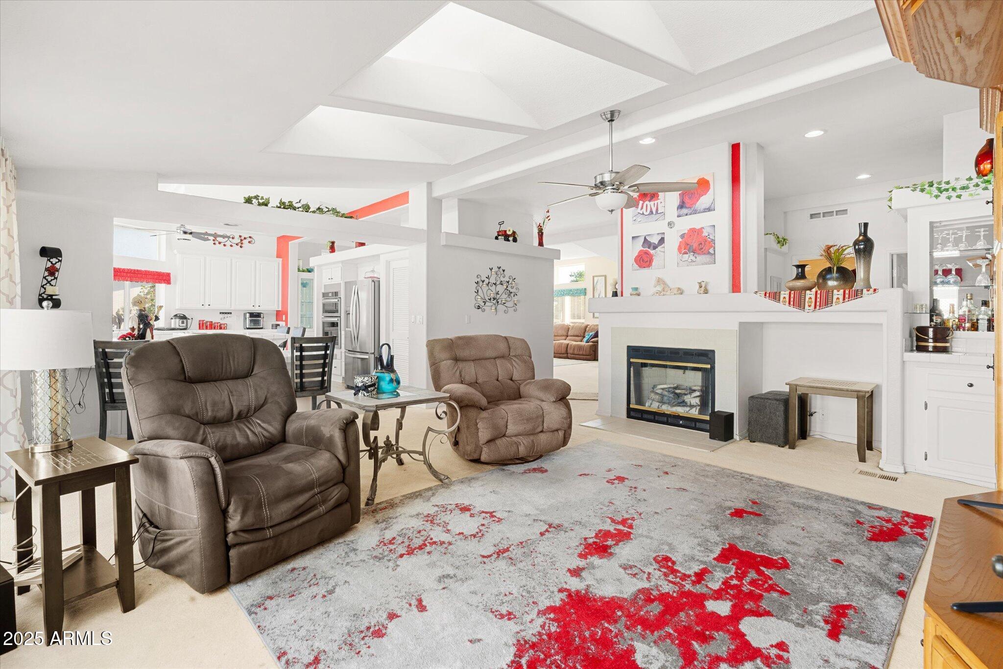 3700 South Tomahawk Road, Unit 26 & 27 Apache Junction, AZ 85119 - Photo 13 of 62 a living room with furniture and a fireplace