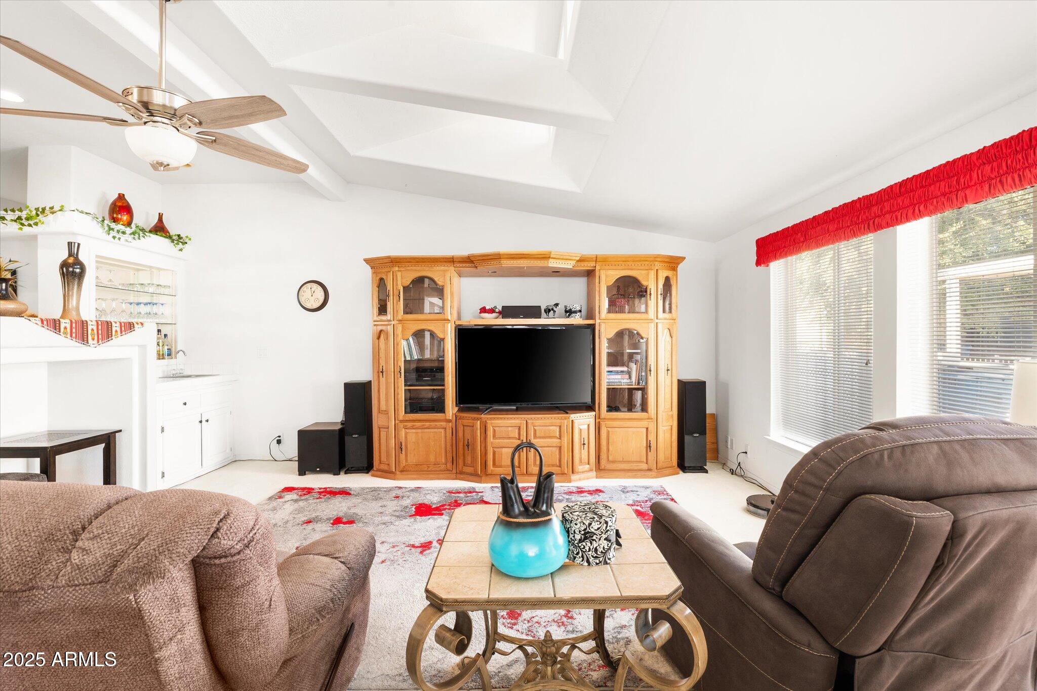 3700 South Tomahawk Road, Unit 26 & 27 Apache Junction, AZ 85119 - Photo 15 of 62 a living room with furniture and a flat screen tv